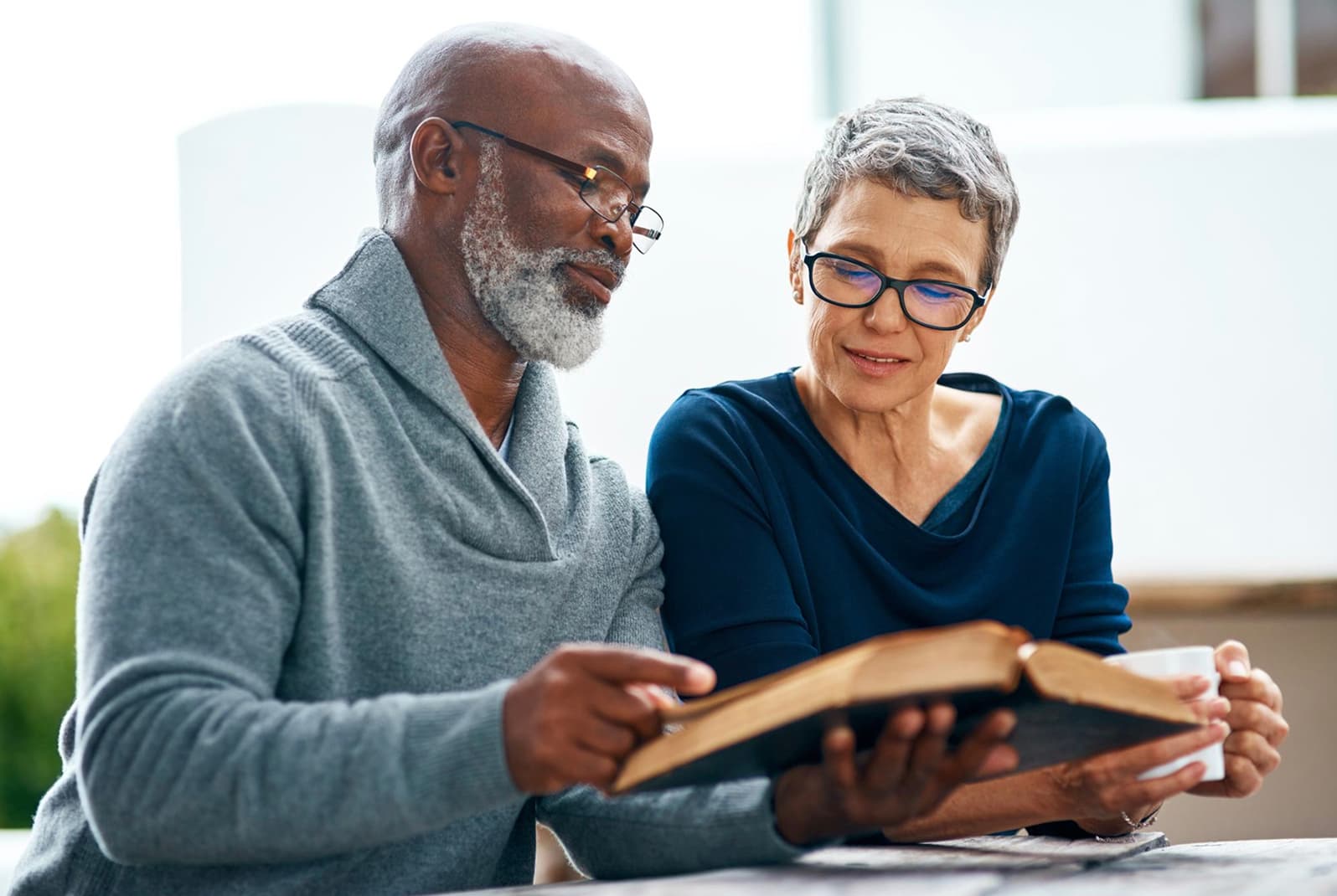 Senior Christian couple studying together