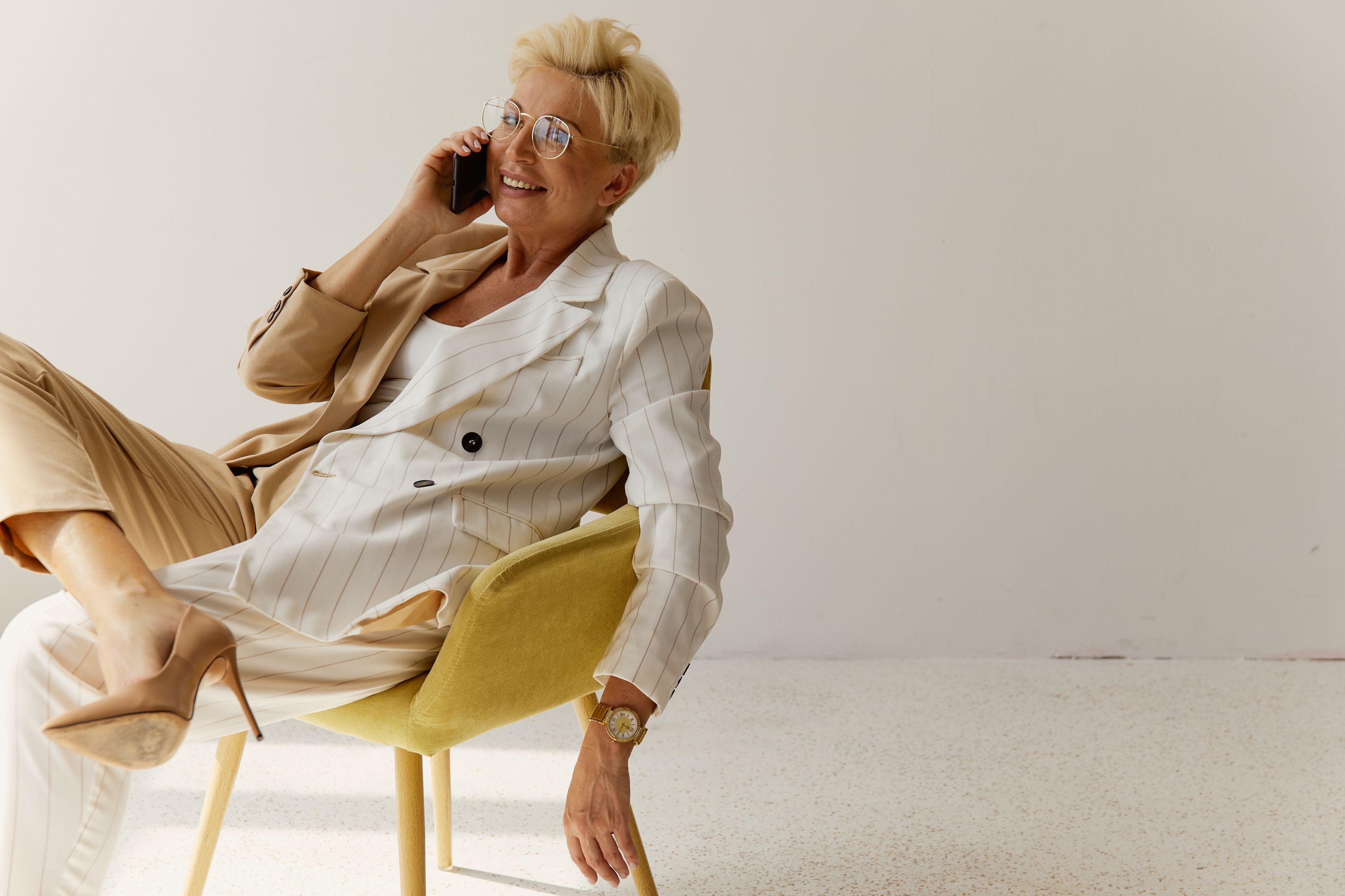 Mature woman smiling while using smartphone — Sequel blog