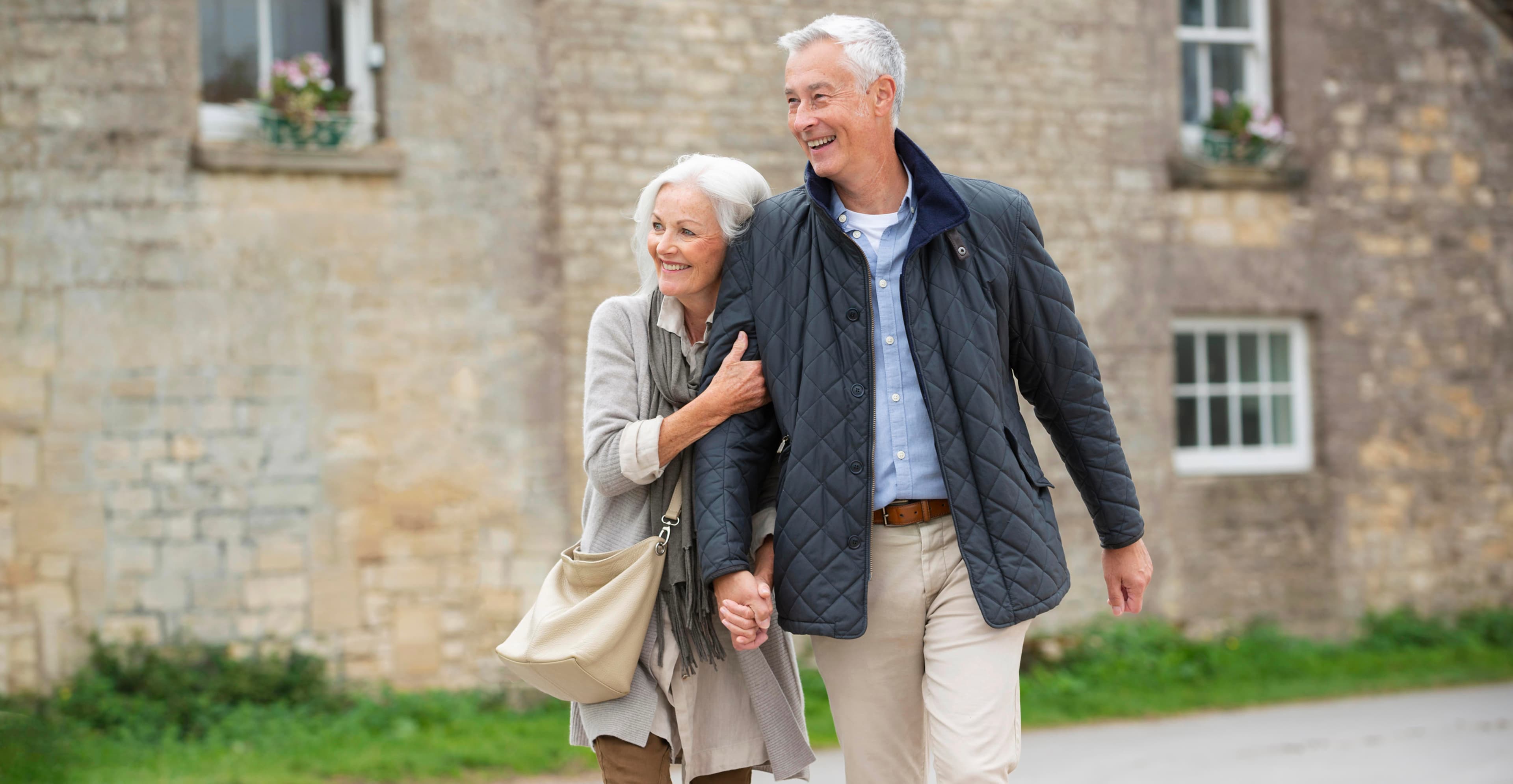 Senior couple embracing outdoors — Sequel, curated dating app for over 50