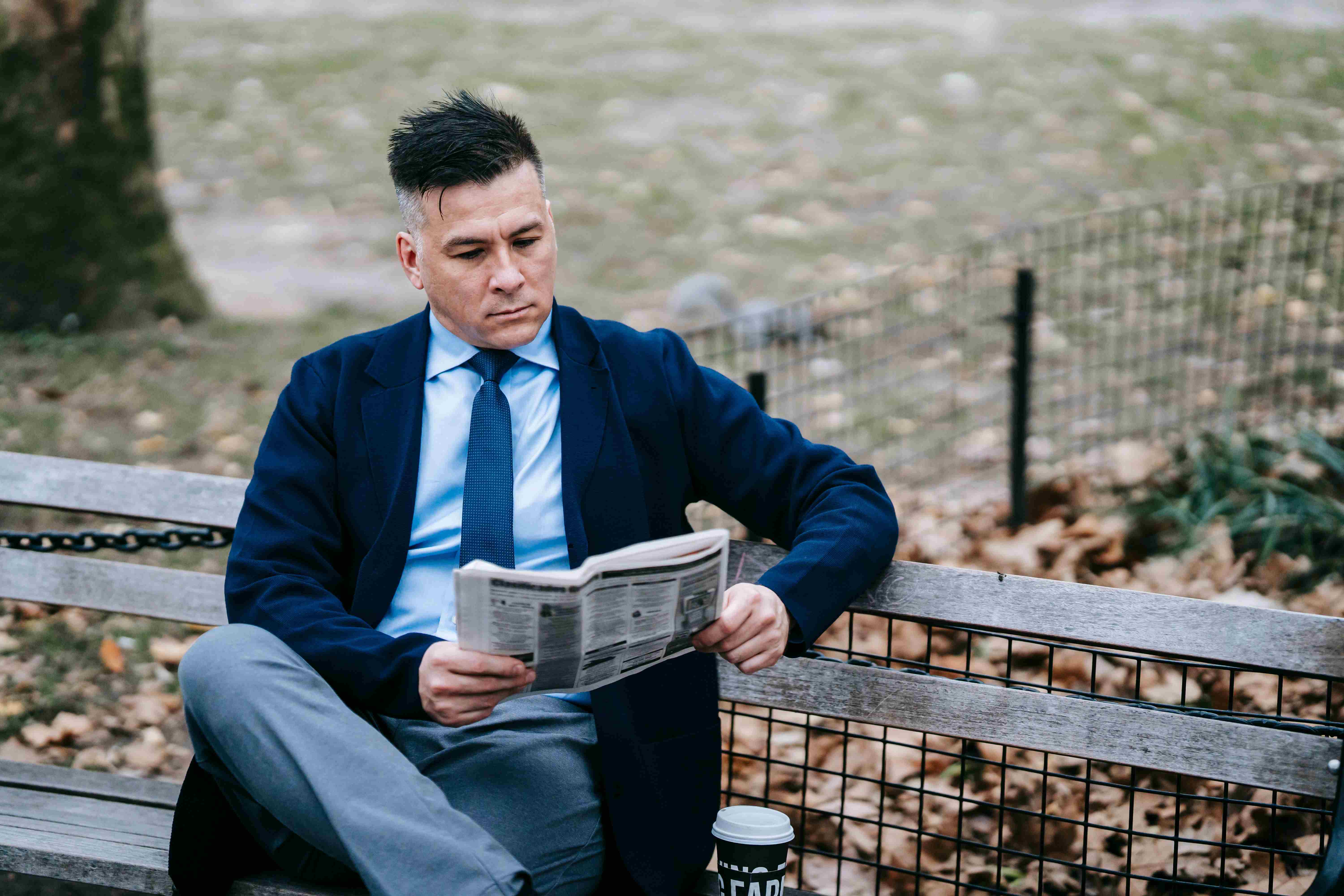 Mature man with glasses using a dating app on his phone
