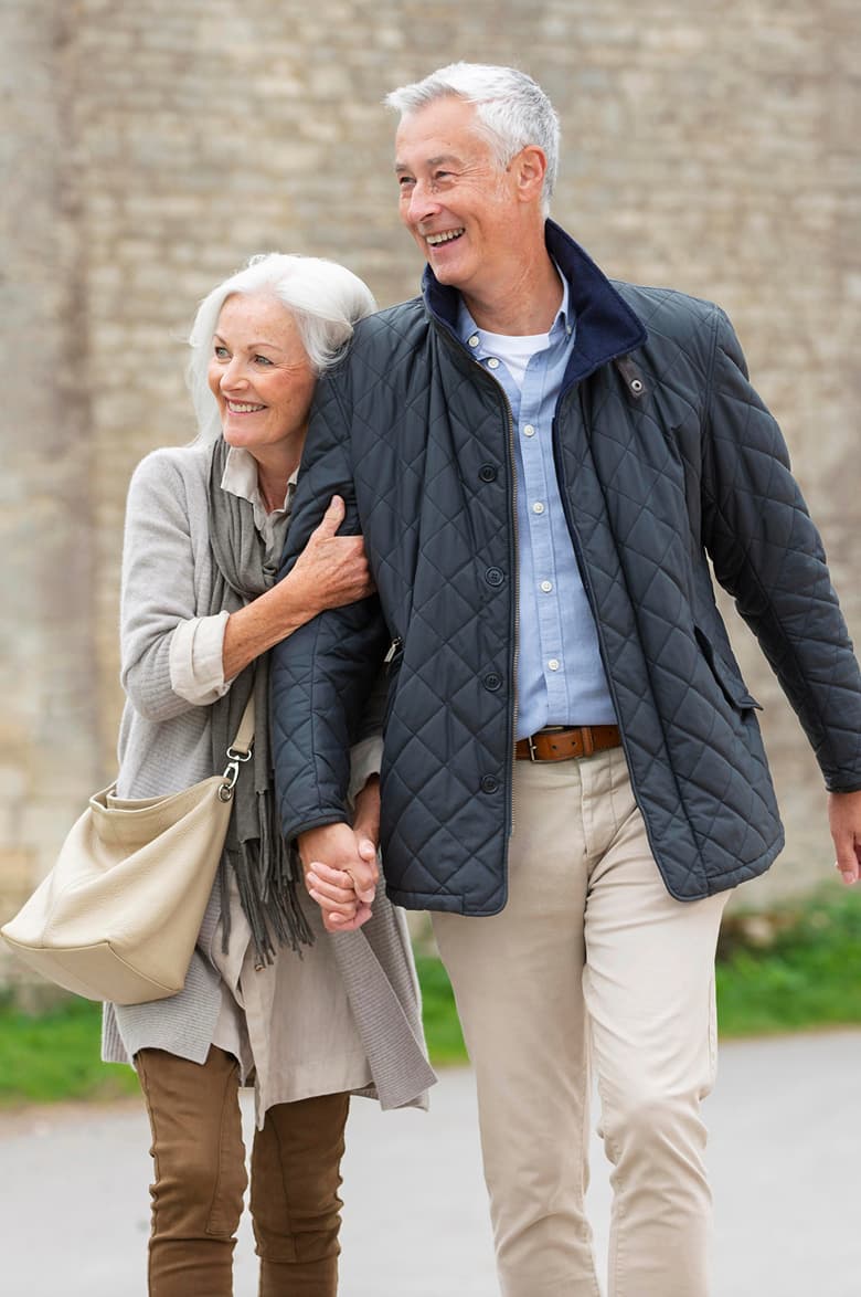 Senior couple embracing outdoors — Sequel, curated dating app for over 50