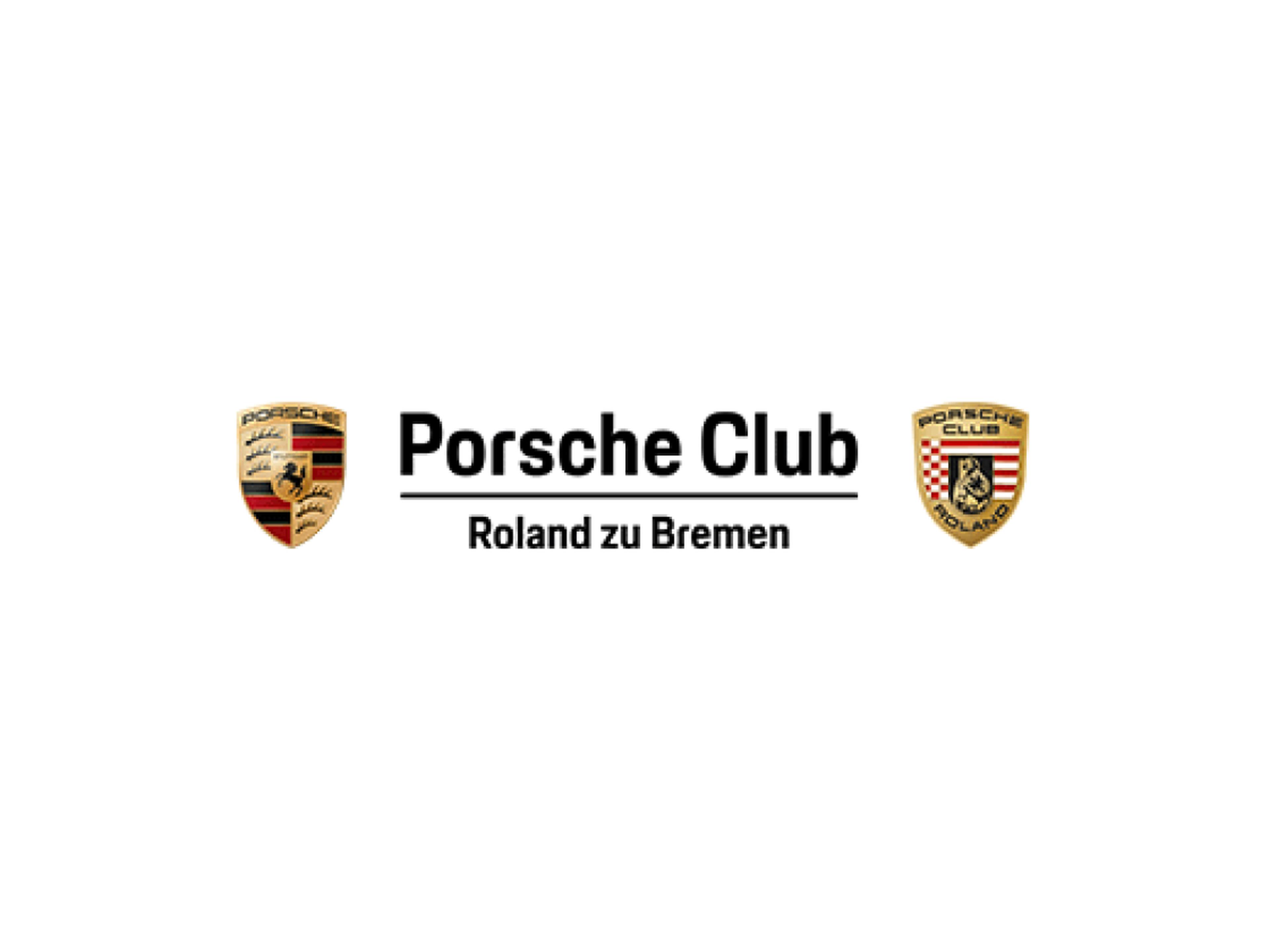 Mehrere Porsche fahren eine Serpentinenstraße entlang.