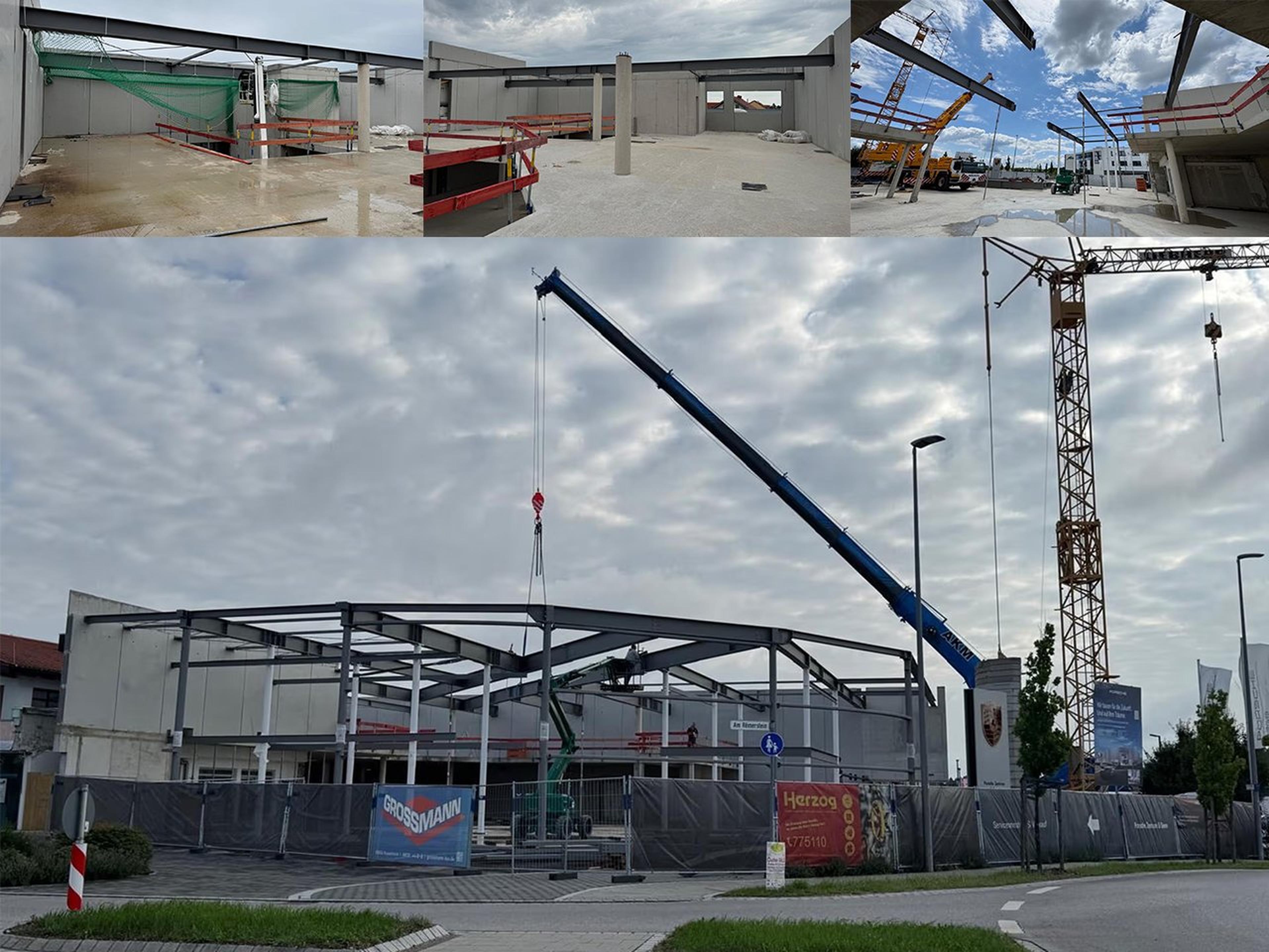 Baustelle mit Stahlgerüst eines Gebäudes, zwei Kränen und Bauzaun im Vordergrund unter bewölktem Himmel