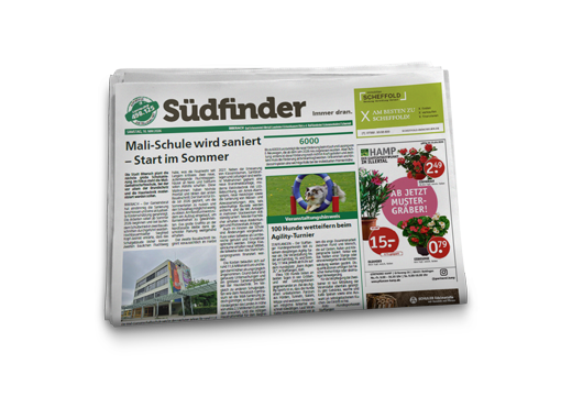 Abbildung der Wochenzeitung Südfinder: lokale Nachrichten und regionale Werbung in einem Umfeld, das gelesen wird.