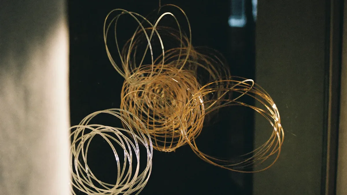 Fibre-optic strands catching amber light