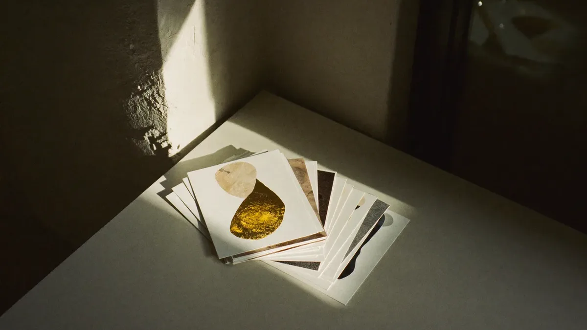 Paper colour swatches fanned across a pale table