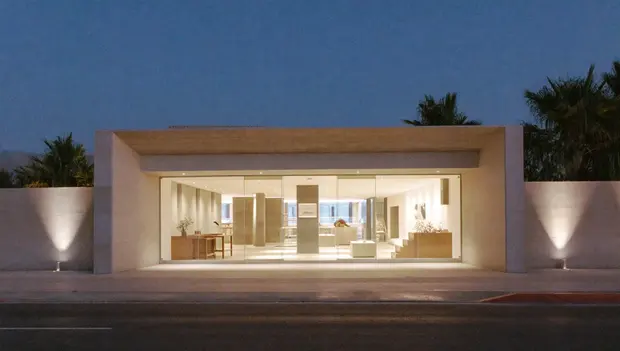 Lit entrance of a modern Dubai medical clinic at dusk
