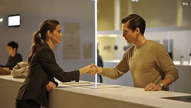 Handshake at a trade exhibition stand
