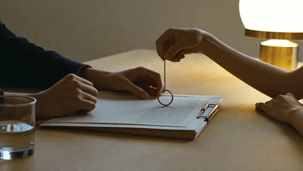 Keys handed across a table at a property completion
