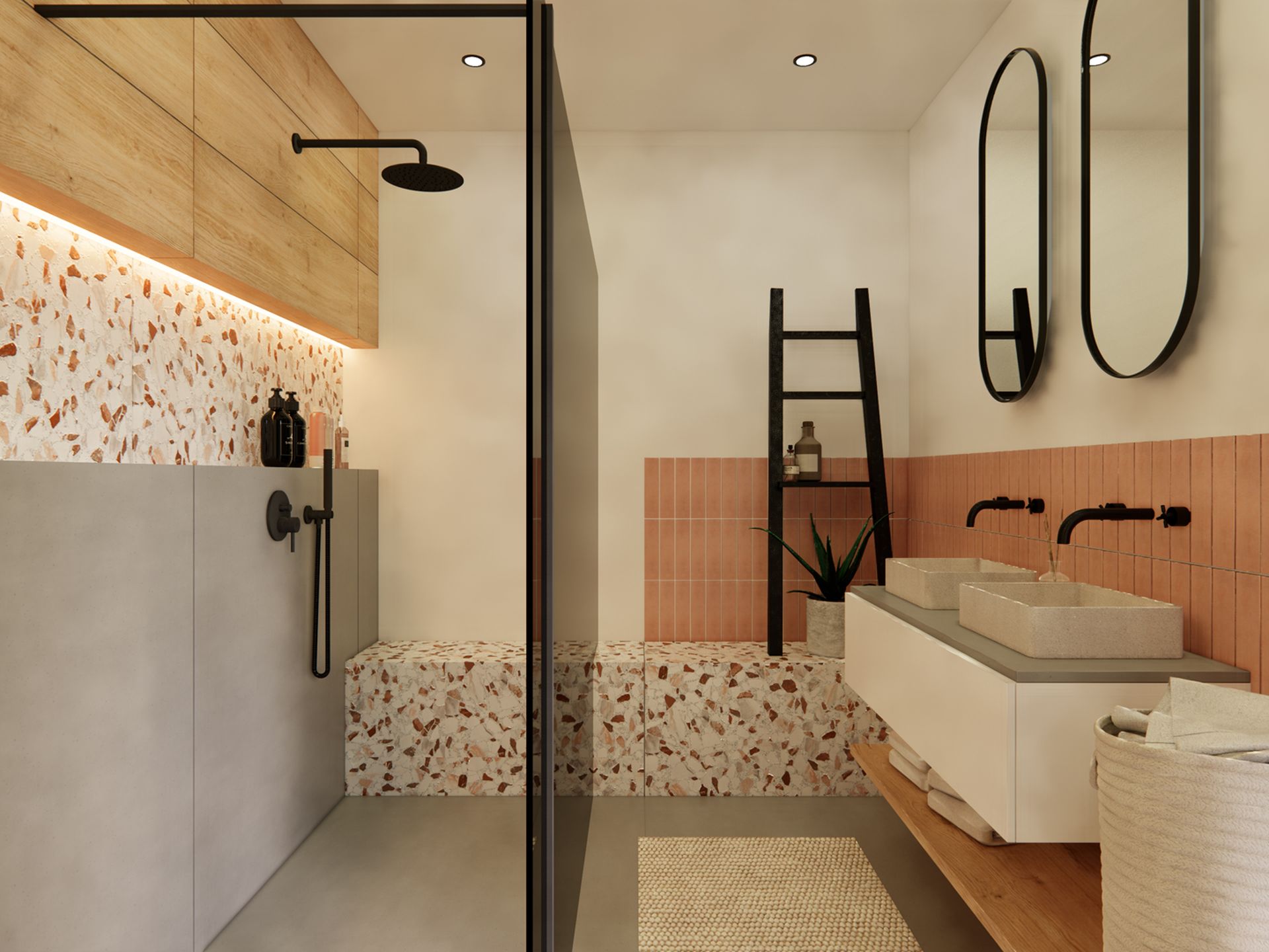 Toekomstbestendige badkamer met dubbele wastafel, inloopdouche, terrazzo zitbank en warme wandtegels.
