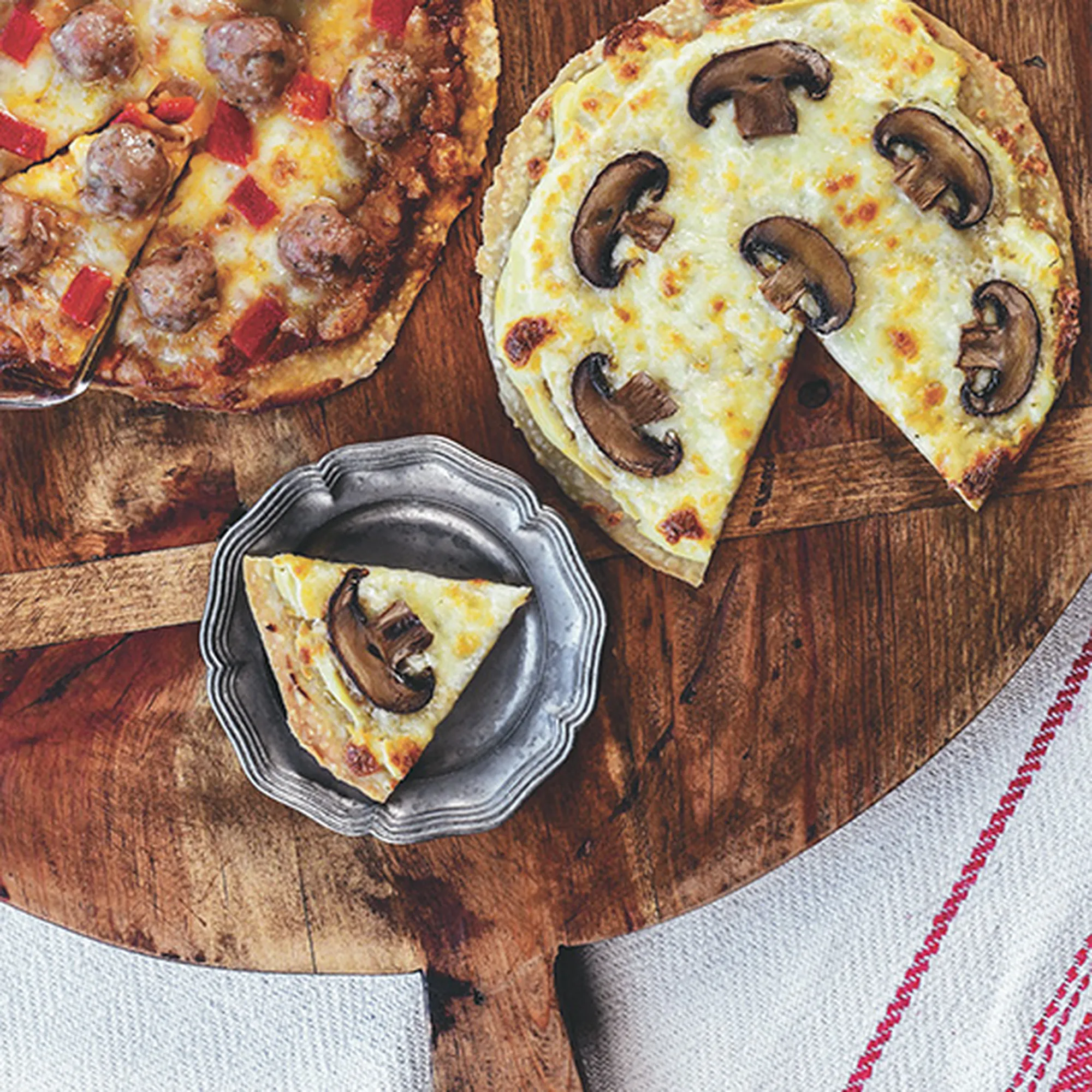 a pizza on a cutting board