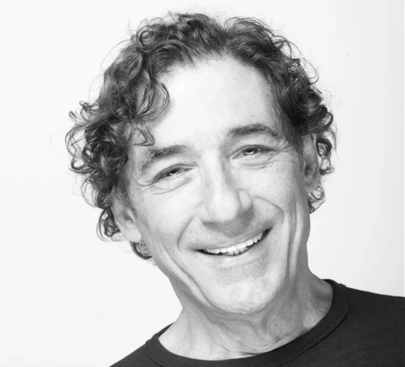 a man smiling for a picture