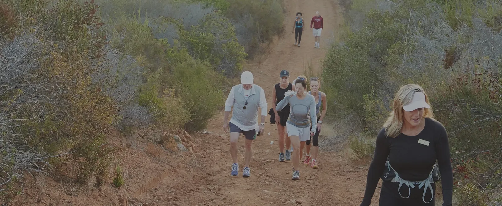 Guests on the Cal-a-Vie morning hike, walking the vineyard trail through the Provençal-inspired hillside at first light