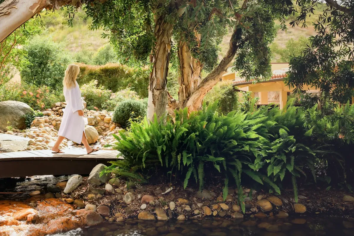 A garden bridge leading toward the spa at Cal-a-Vie Health Spa