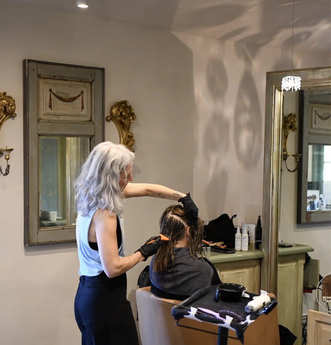 a woman getting her hair done