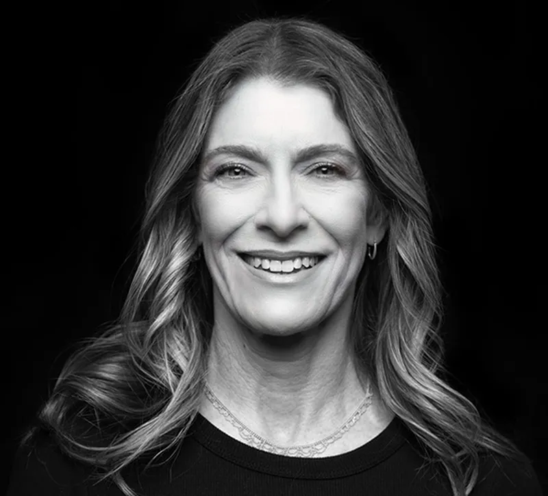 a woman smiling for a picture