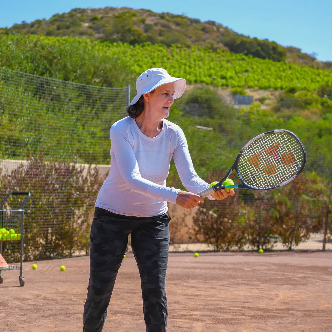 a woman holding a tennis racket