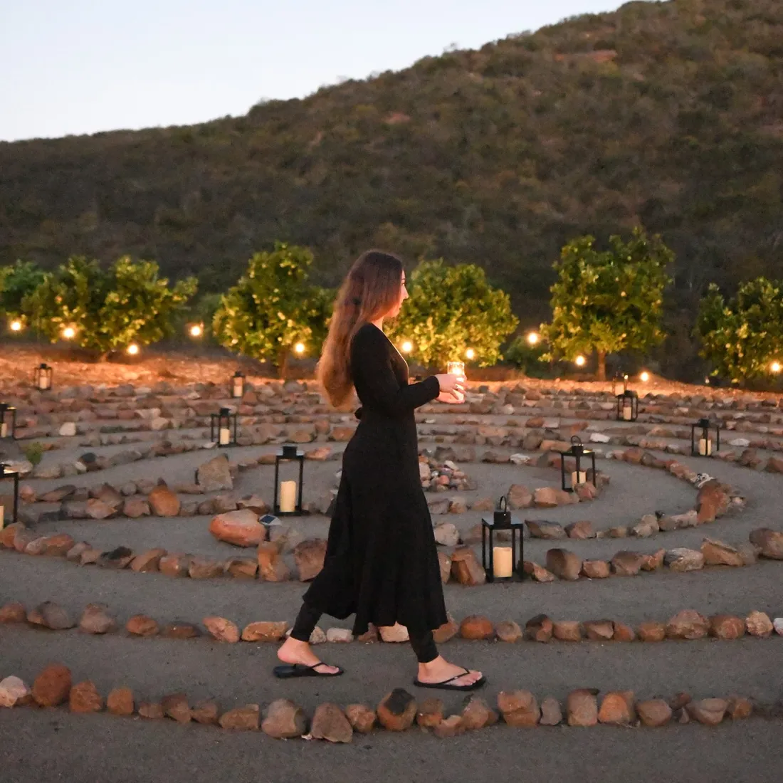 a woman walking in a labyrinth