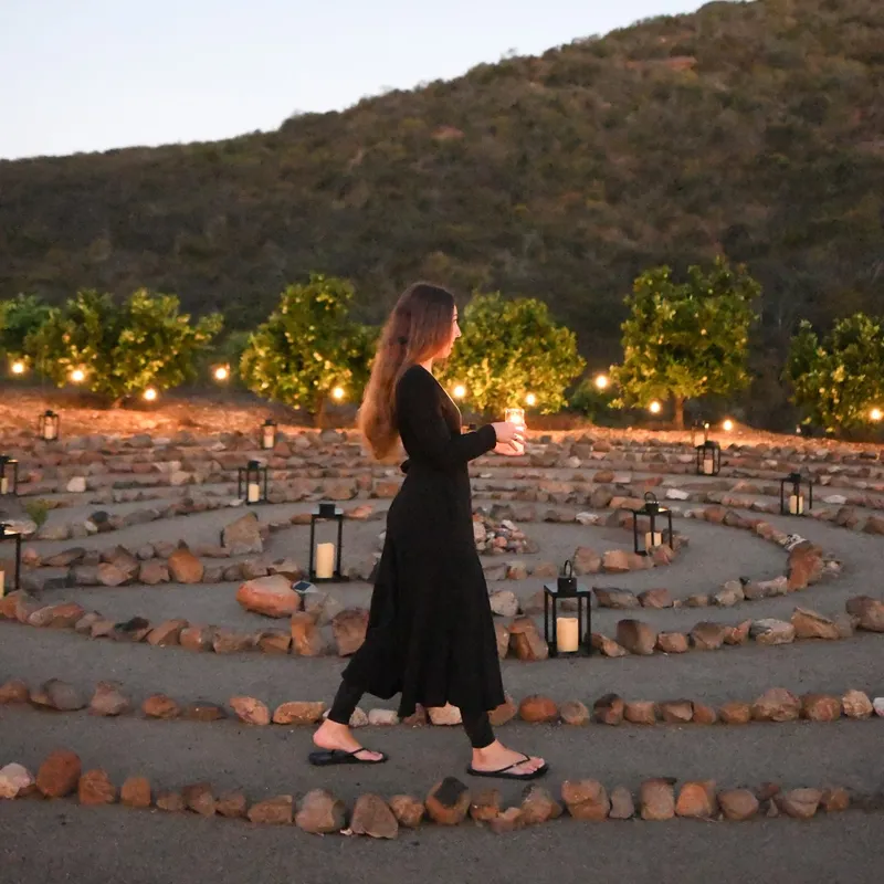 a woman walking in a labyrinth
