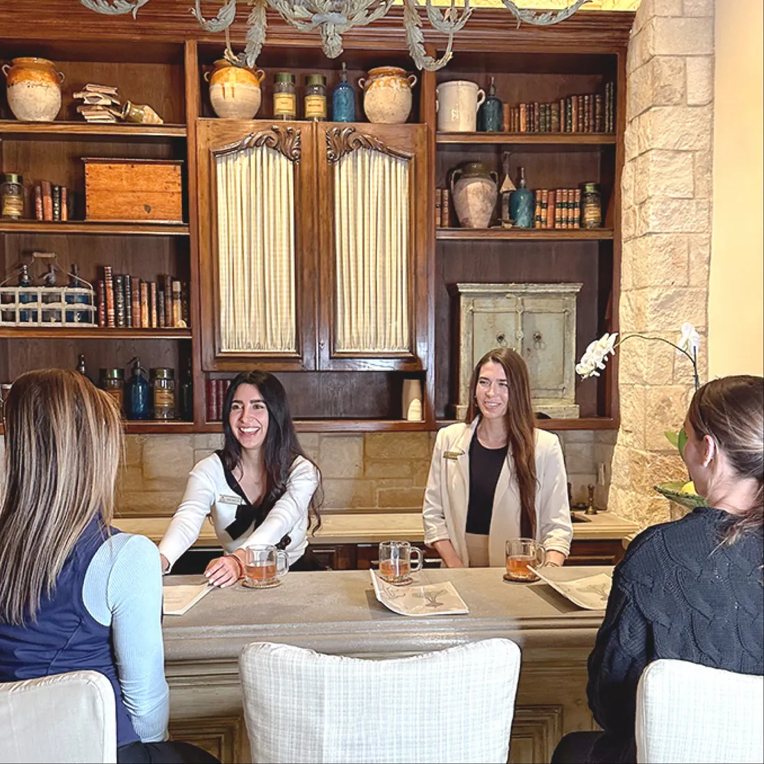 a group of women sitting around a table