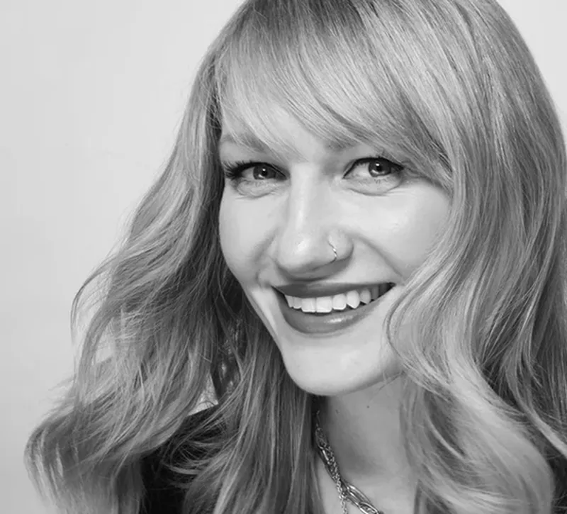 a woman smiling at the camera