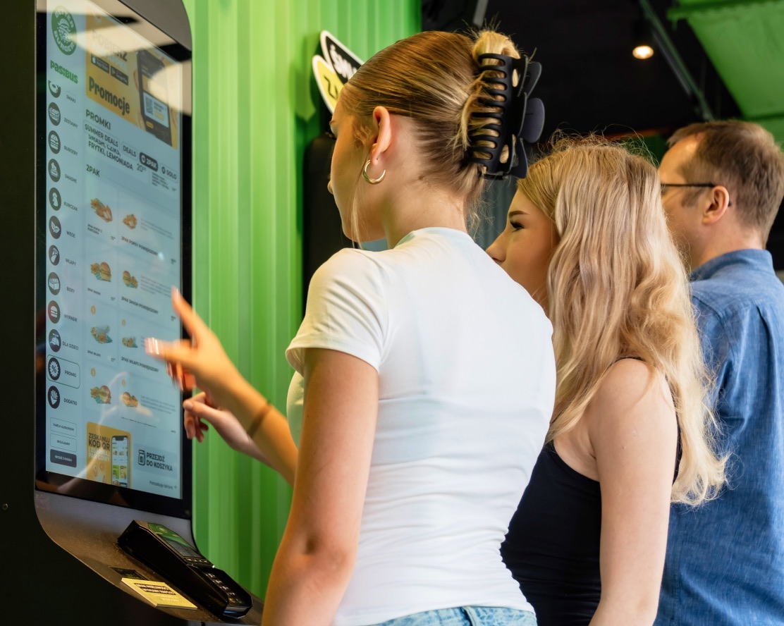 Guest adding a recommended side dish on a self-service kiosk screen