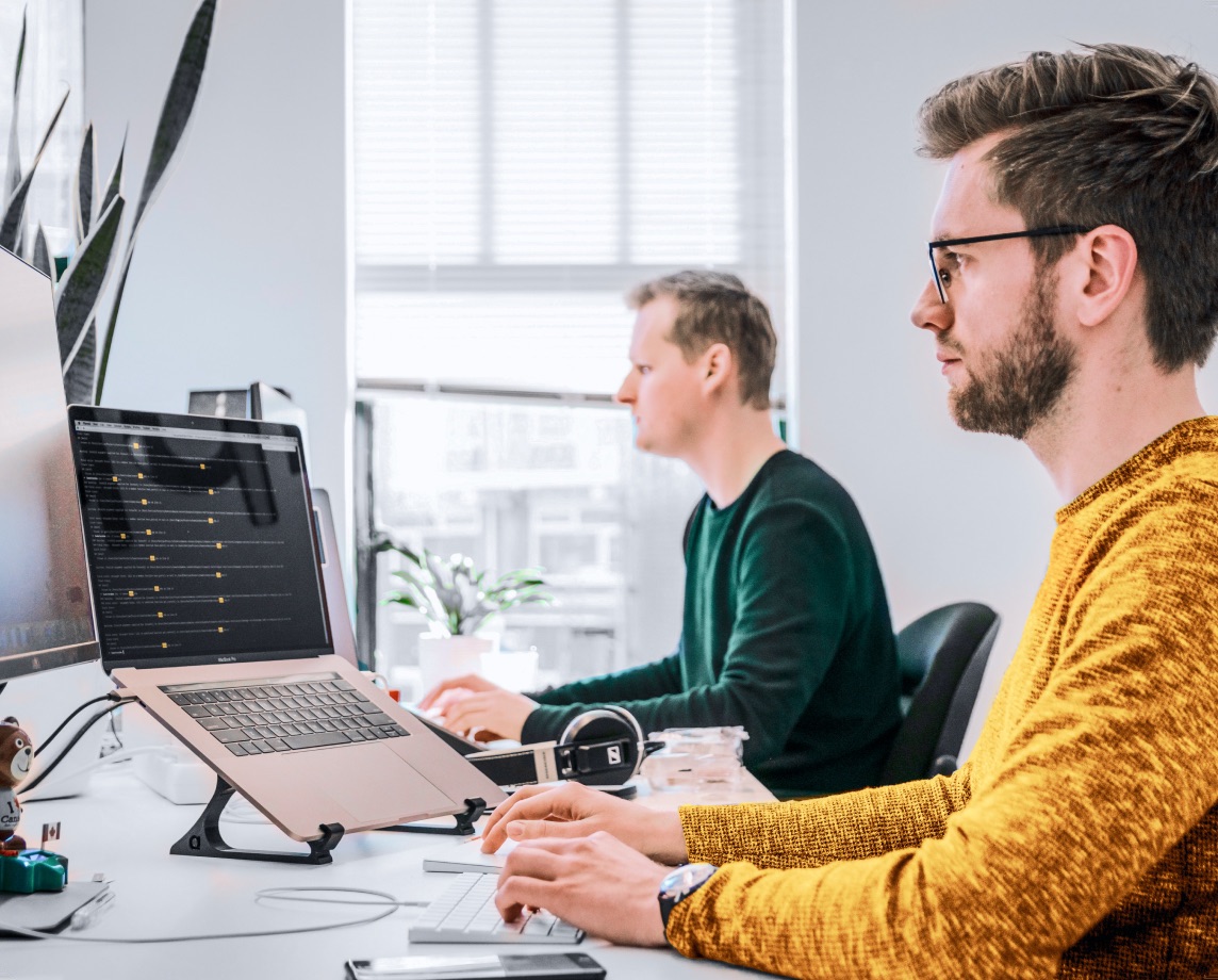 Support engineer resolving a technical query at a desk