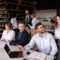 Ordering Stack team meeting around a table
