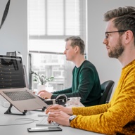 Developers working together in the 3e office