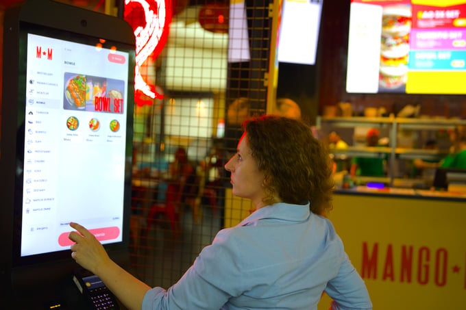 Guest ordering on a Mango Mama self-service kiosk
