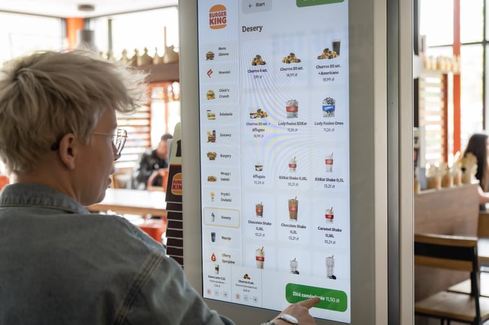 Guest browsing the Burger King menu on a self-service kiosk