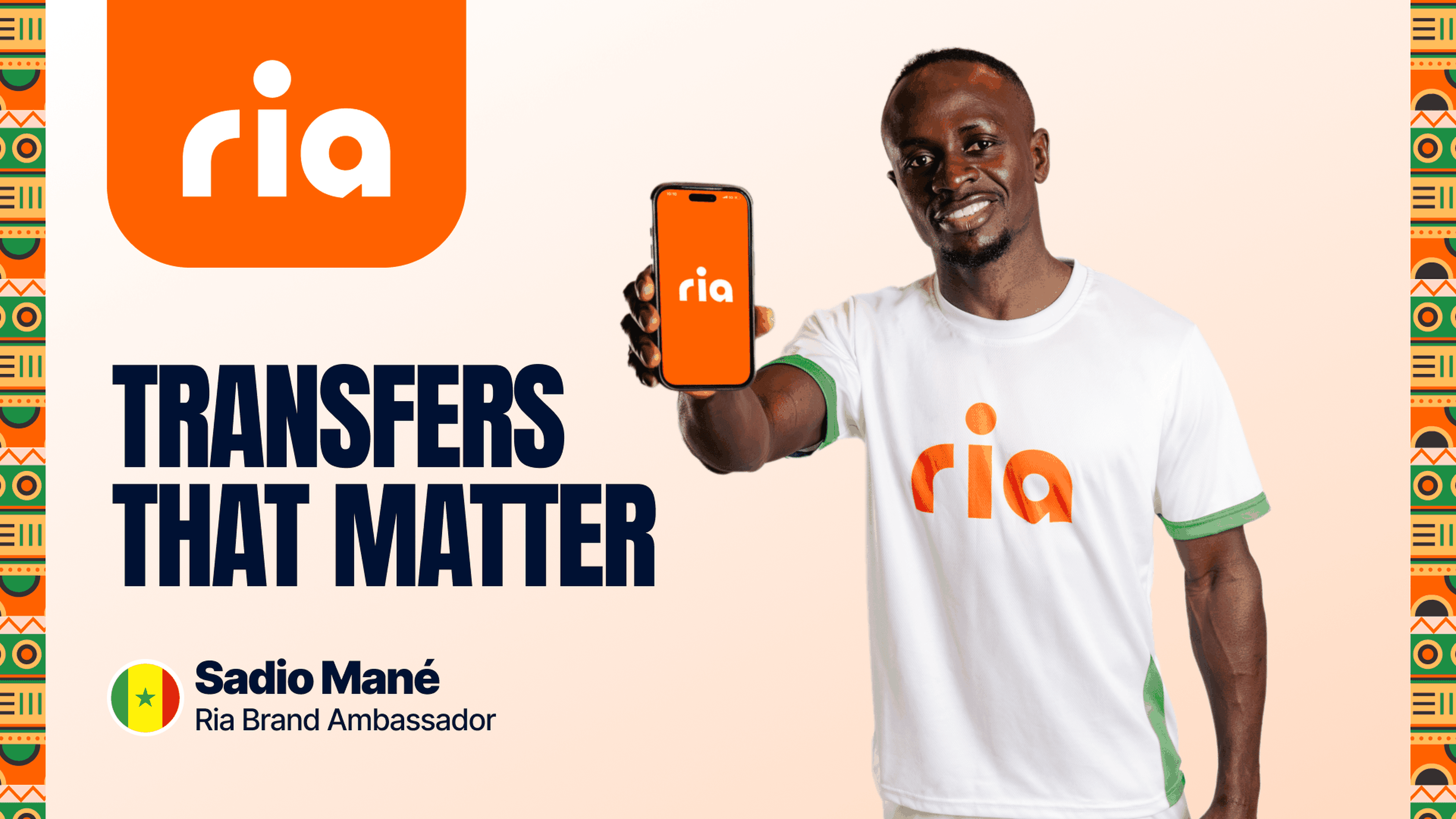 A man wearing a white "ria" logo t-shirt smiles and holds up a phone displaying the same logo. Text reads "Transfers That Matter." Below, "Sadio Mané, Ria Brand Ambassador," appears next to a Senegal flag. Sadio Mané inspires global connections.