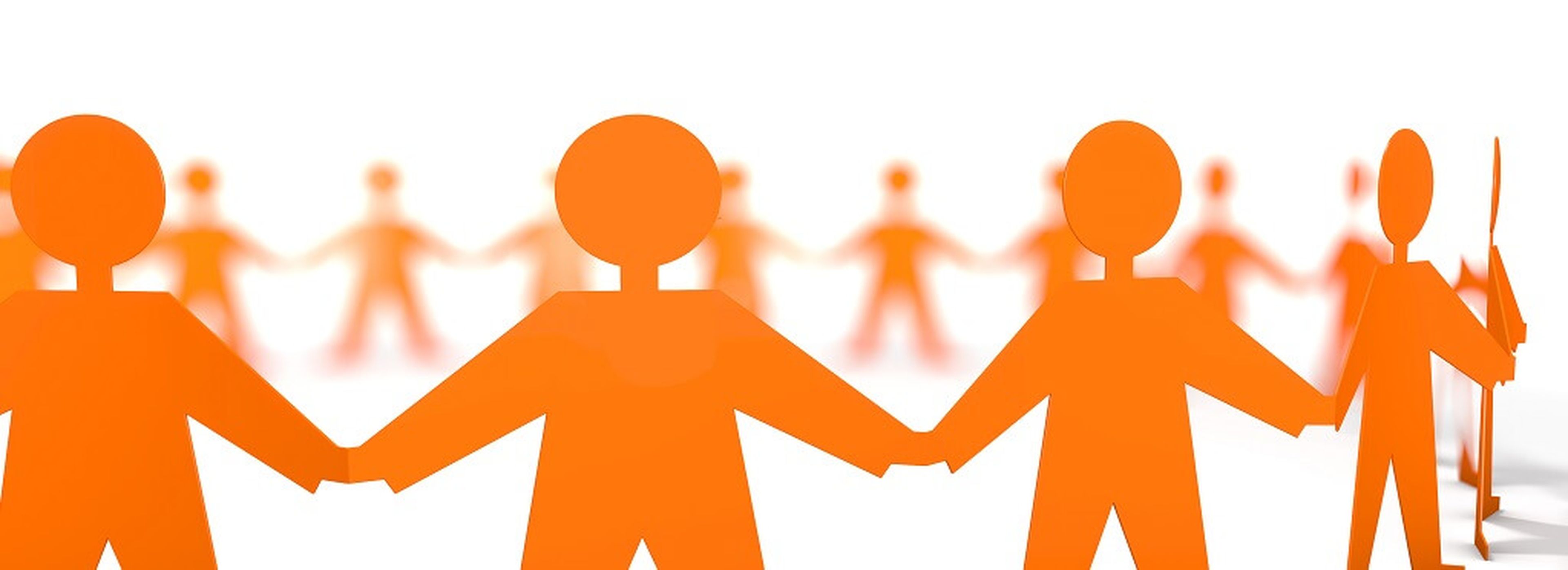 An illustration of orange, gender-neutral human figures holding hands in a line, with some of the figures blurred in the background, creating a sense of depth and community. The background is white.
