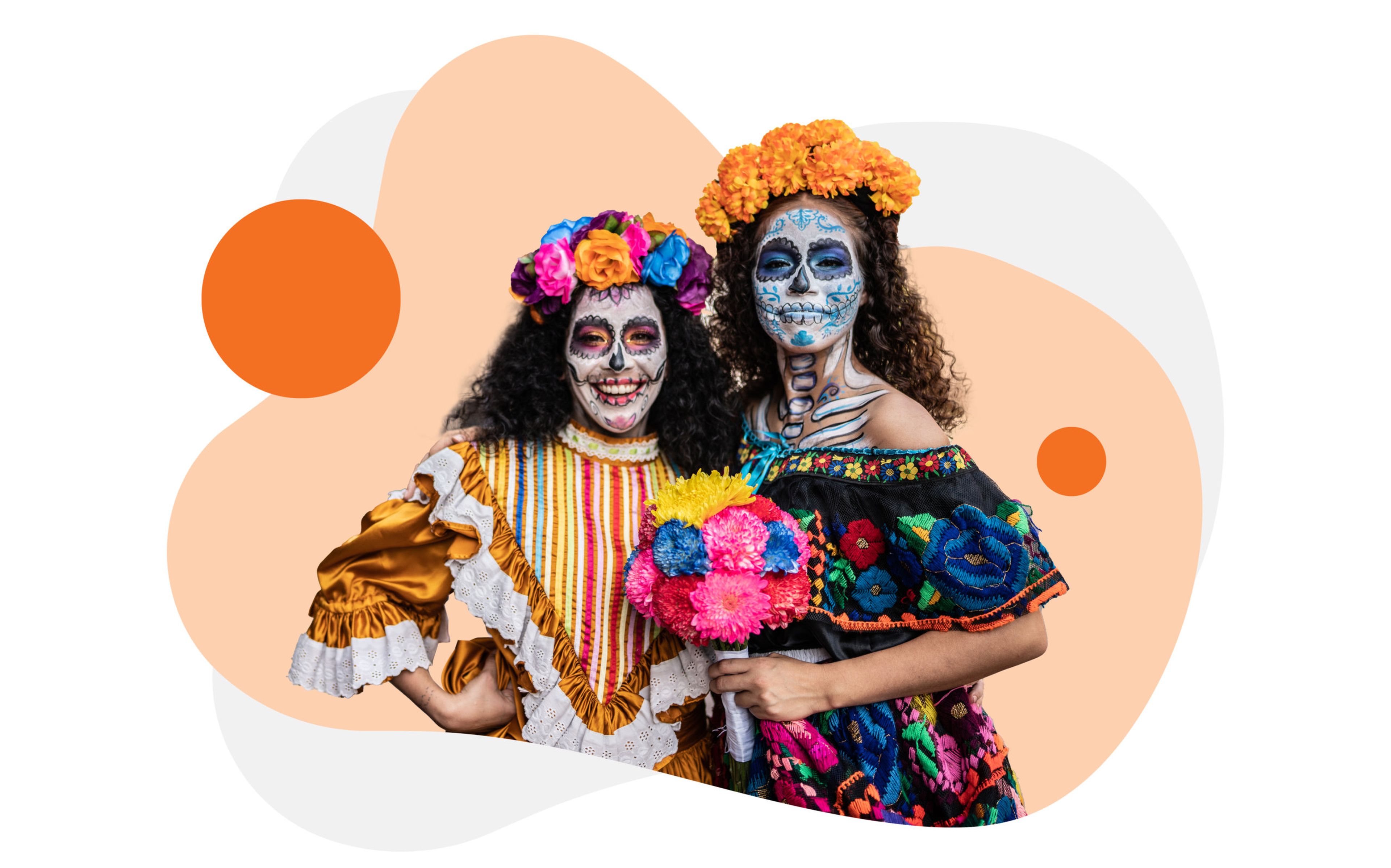 Two people are dressed in traditional Día de los Muertos attire, with faces painted as sugar skulls. One wears a yellow dress with colorful flowers in their hair, and the other wears a black outfit with vibrant floral embroidery, holding a bouquet of colorful flowers.