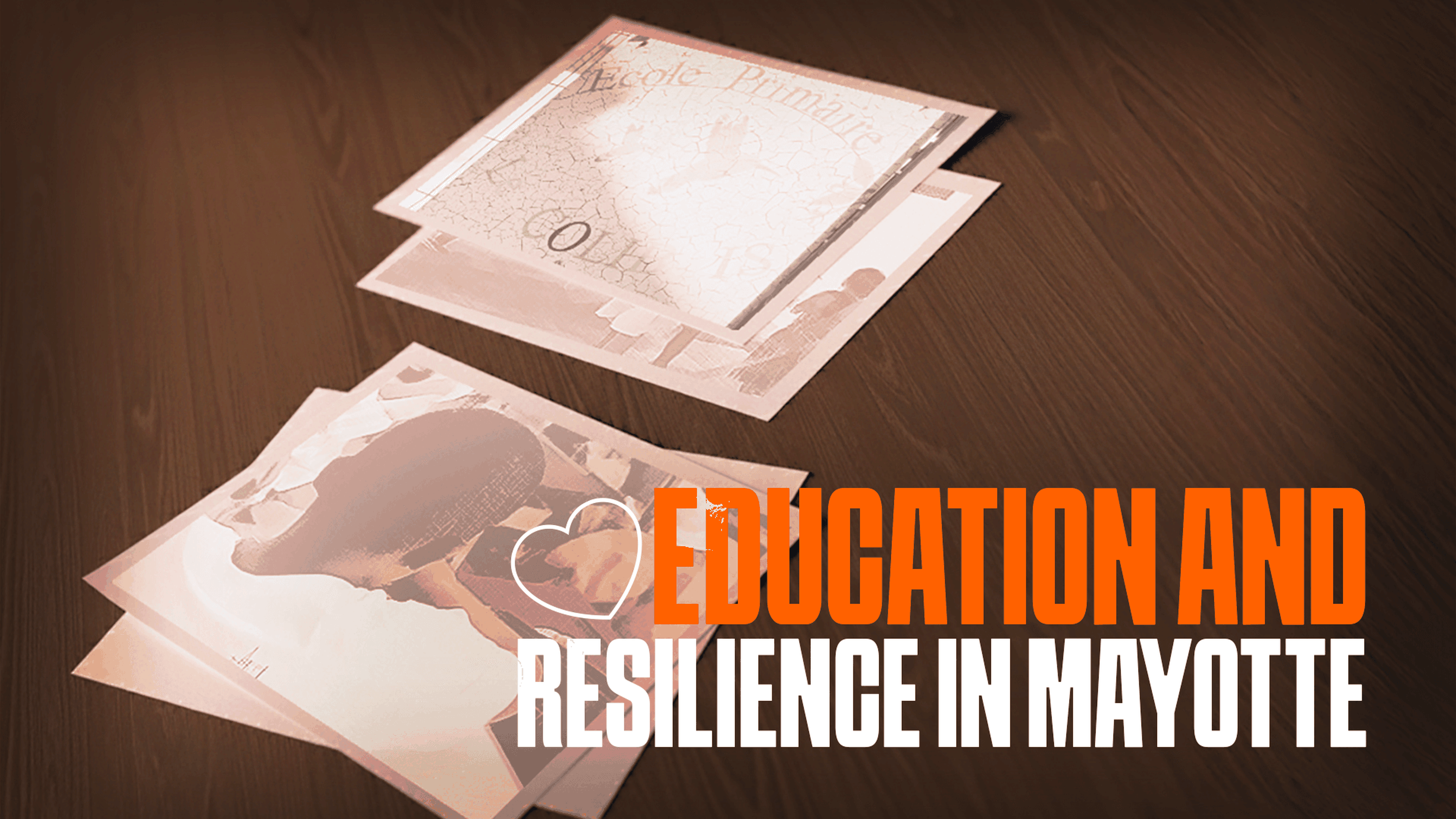 A stack of photographs on a wooden surface, with the text “EDUCATION AND RESILIENCE IN MAYOTTE” in bold orange and white letters.