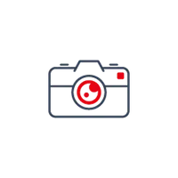 Icon einer Kamera mit roter Linse und seitlichem roten Knopf auf weißem Hintergrund.