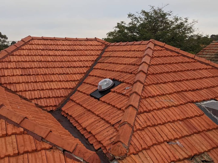 Melbourne tile roof before restoration, faded and worn