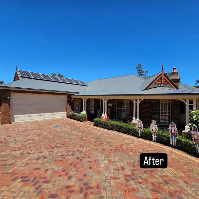 A light-coloured metal roof after restoration on a Melbourne home