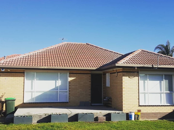 Melbourne tile roof before restoration, faded and worn