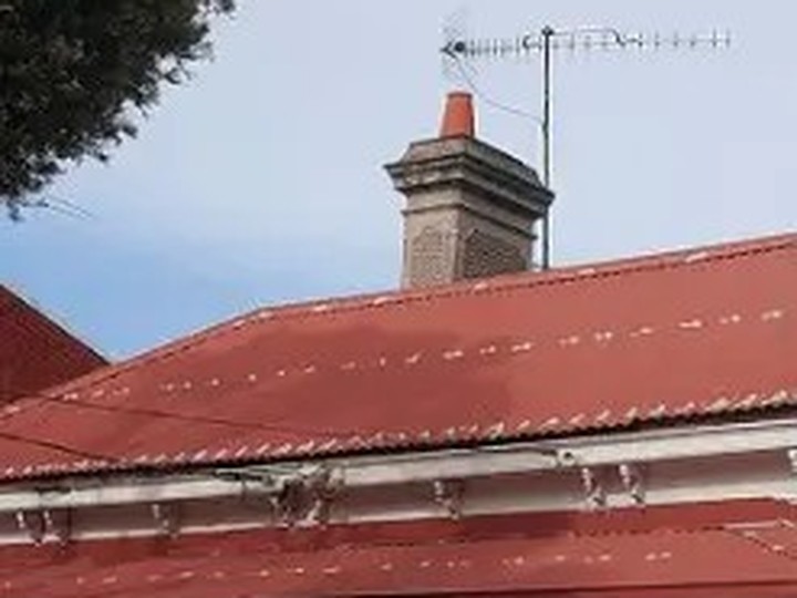 Melbourne period home with a faded iron roof, before restoration