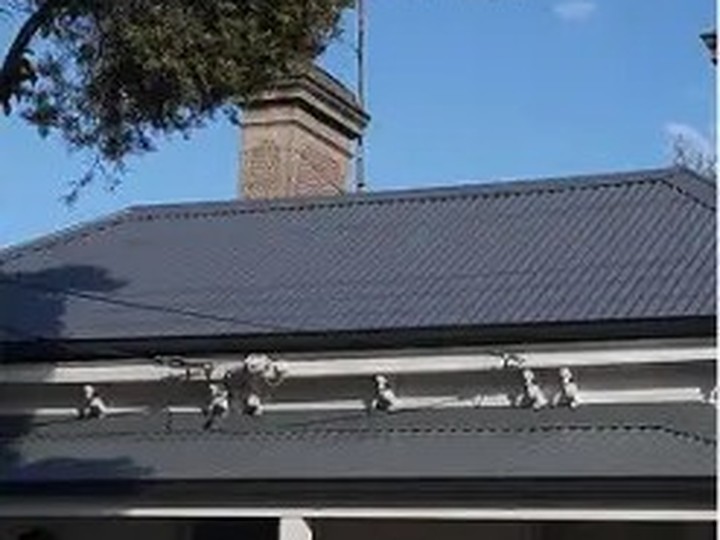 The same iron roof after cleaning, rust treatment and new coats