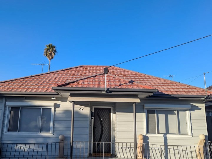 Melbourne tile roof before restoration, faded and worn
