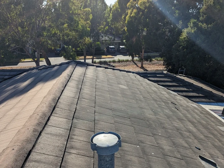 Tile roof before restoration, weathered and faded