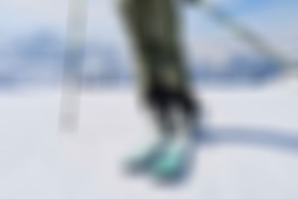 skier from the back on a skiing slope