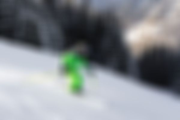 Ski Instructor on the slopes wearing a green jacket from Alpin Skischule Oberstdorf