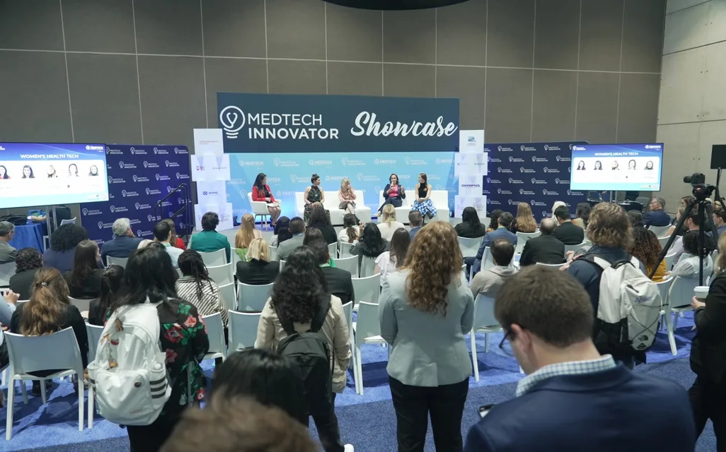 Audience watching a Women’s Health Tech panel on the MedTech Innovator Showcase stage