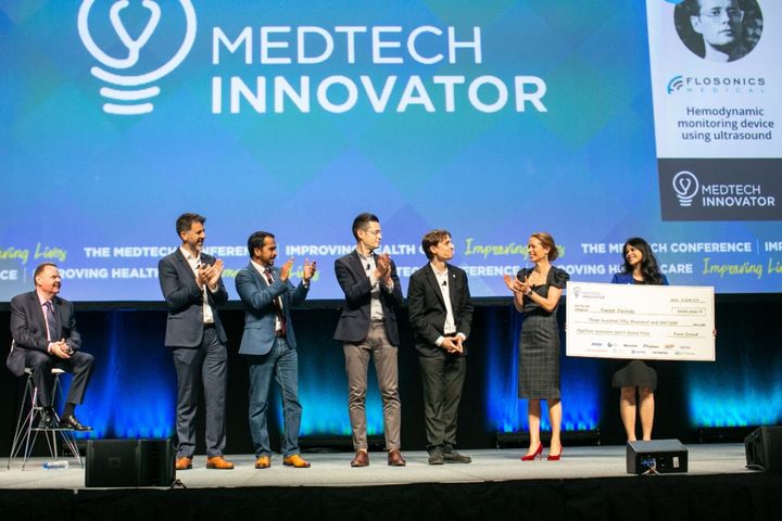 Forest Devices accepting the MedTech Innovator 2019 grand prize check on stage