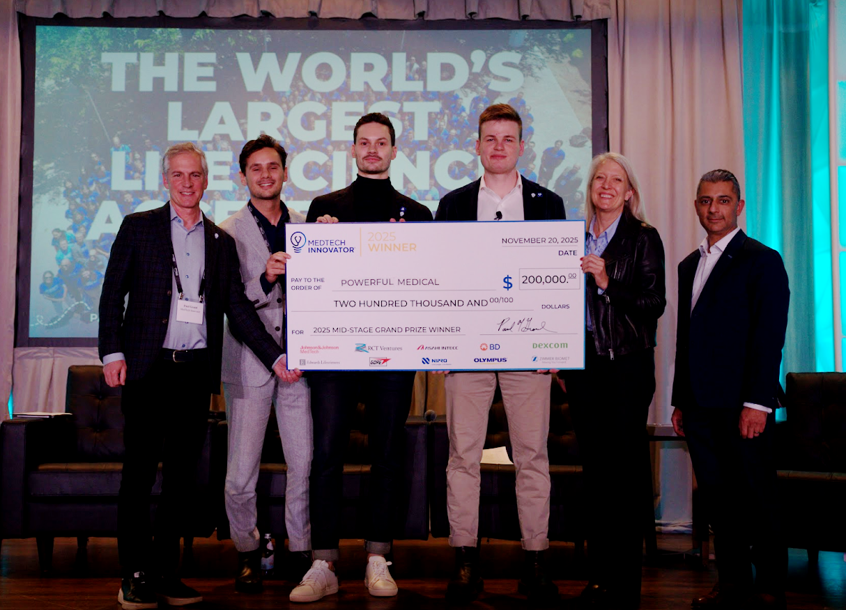 2025 mid-stage grand prize winner powerful medical onstage with check