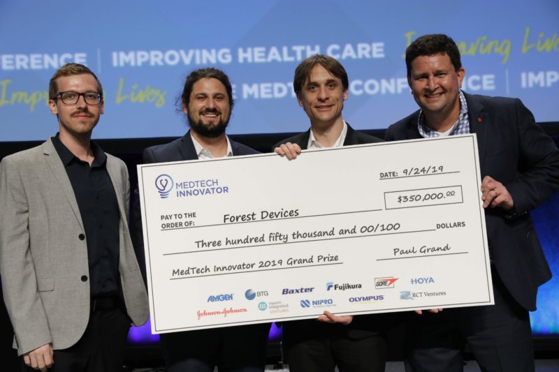 Forest Devices team holding the $350,000 MedTech Innovator 2019 grand prize check