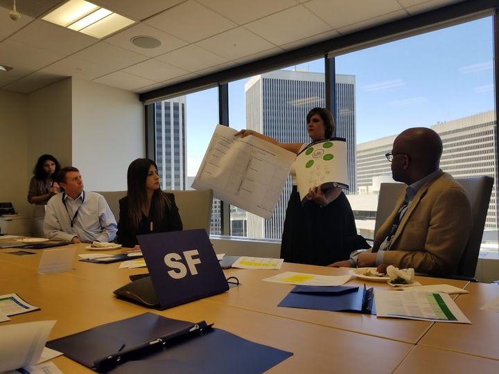 Presenter holding up a worksheet during a MedTech Innovator Summit 2018 workshop in San Francisco